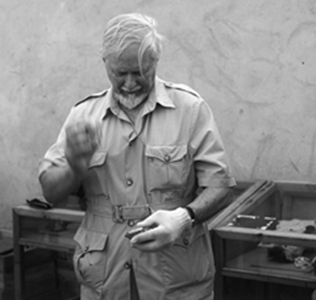 Desmond making stone tool