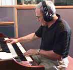 Photo of August Pacetti playing keyboard.