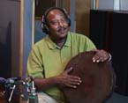 Photo of Sileshi playing the Ethiopian drum.